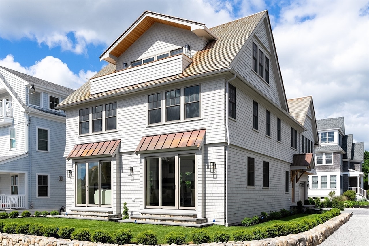 2 Collier Road, Scituate. Shingle-style exterior with copper bay roofs.